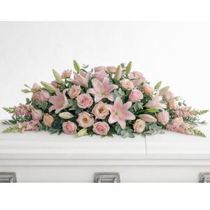Blush Tribute Casket Flowers - Pink roses, lilies and snapdragons casket arrangement